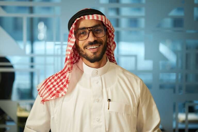 smiling-adult-man-in-traditional-outfit-at-workpla-2026-03-25-07-06-12-utc (1)